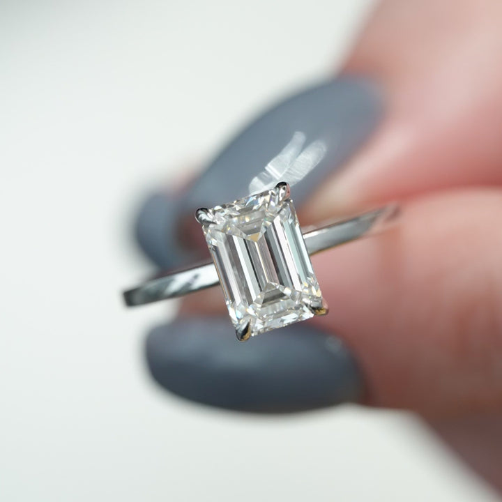 The Estella Emerald Lab Diamond Moissanite Engagement Ring *Shown with 2 ct #material_white