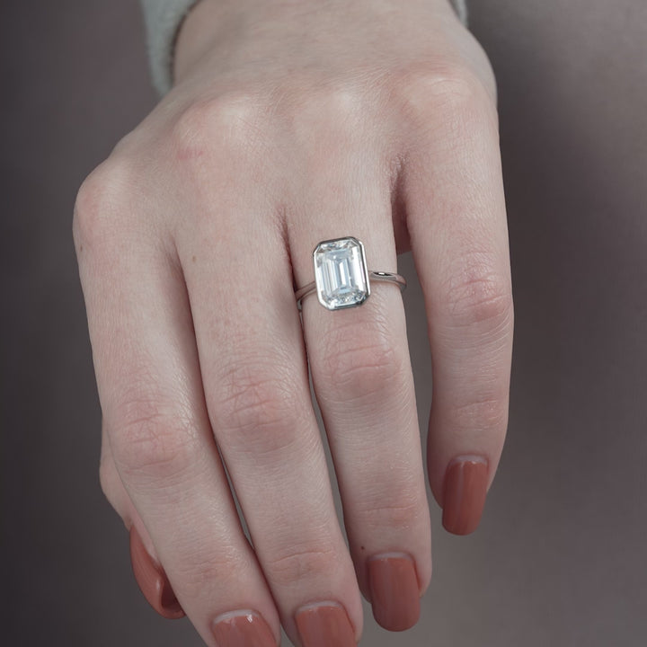 The Christine Emerald Lab Diamond Moissanite Engagement Ring *Shown with 5 ct #material_white