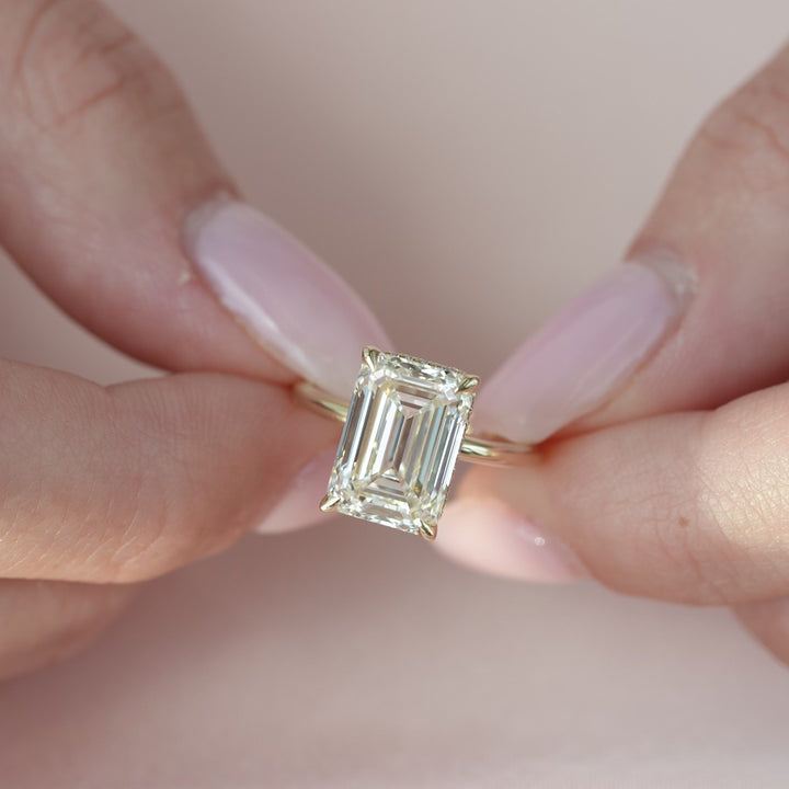 The April Emerald Lab Diamond Moissanite Engagement Ring *Shown with 5 ct #material_gold