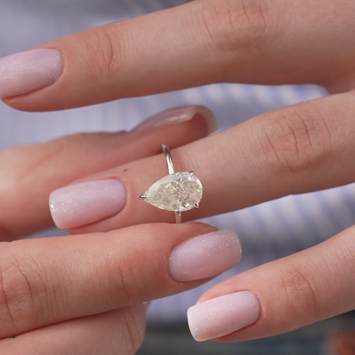 The Navy Pear Lab Diamond Moissanite Engagement Ring *Shown with 3 ct #material_white