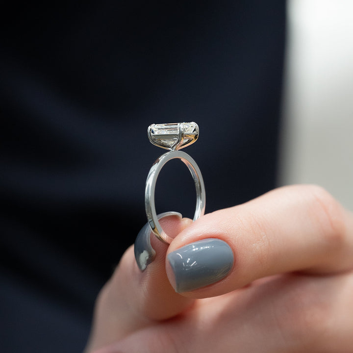 The Estella Emerald Lab Diamond Moissanite Engagement Ring *Shown with 2 ct #material_white