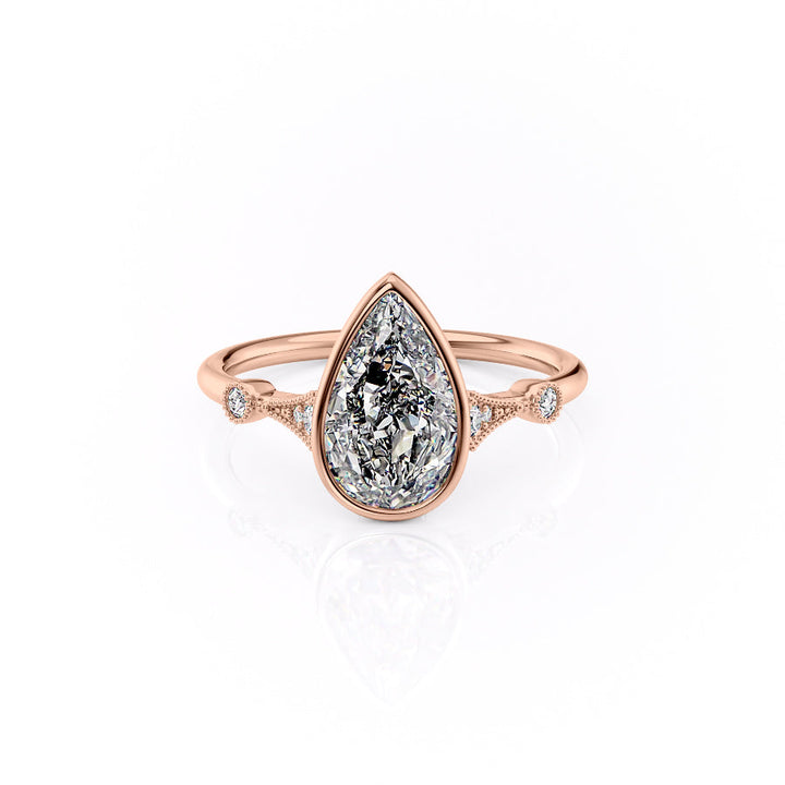 Rose gold ring with a pear-shaped diamond on a white background#material_rose