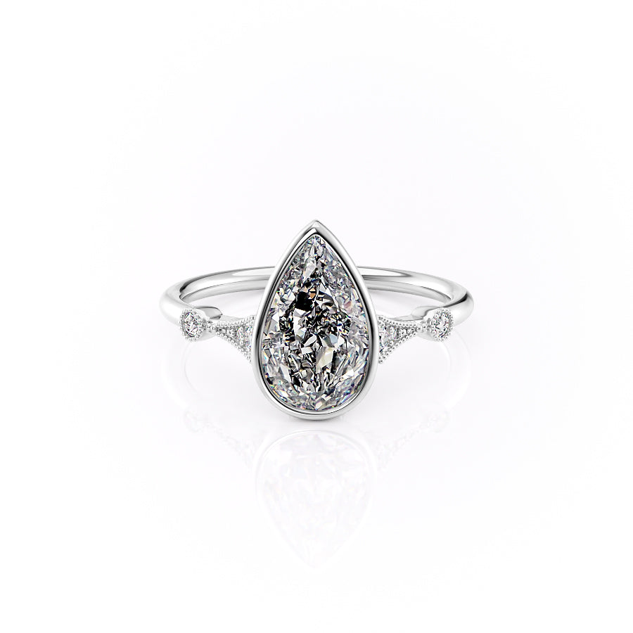 Diamond ring with a pear-shaped center stone on a white background#material_white