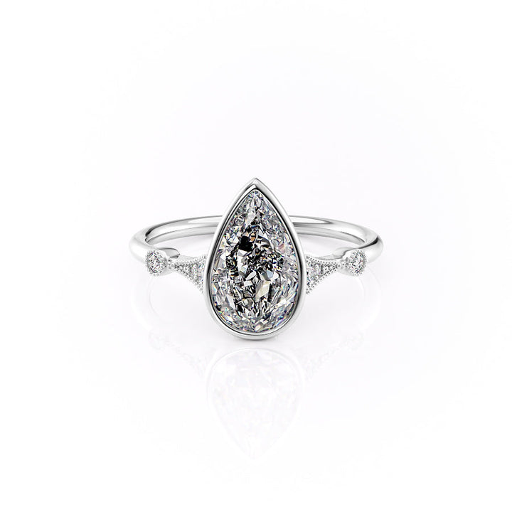 Diamond ring with a pear-shaped center stone on a white background#material_white