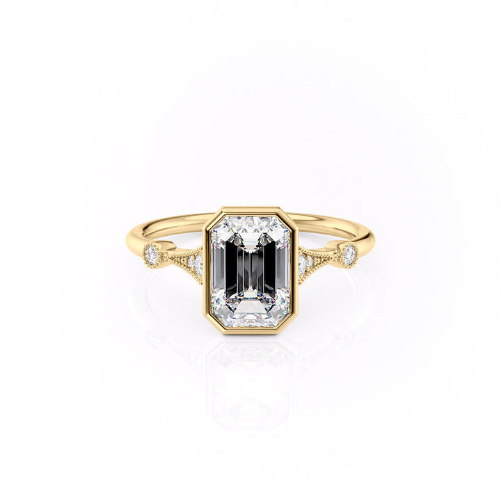 Gold ring with a central emerald-cut gemstone and diamond accents on a white background#material_gold