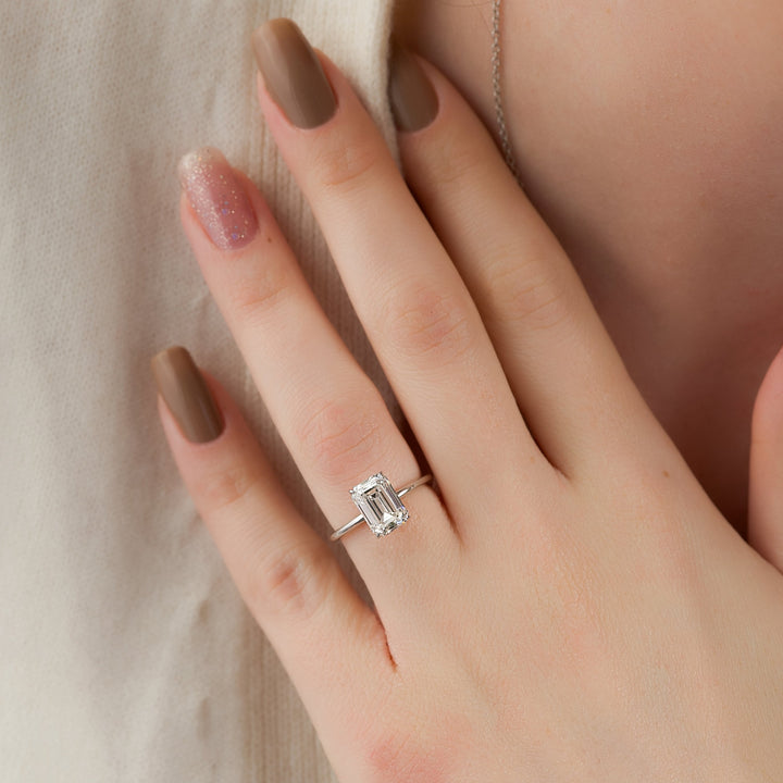 The April Emerald Lab Diamond Moissanite Engagement Ring *Shown with 3 ct #material_white