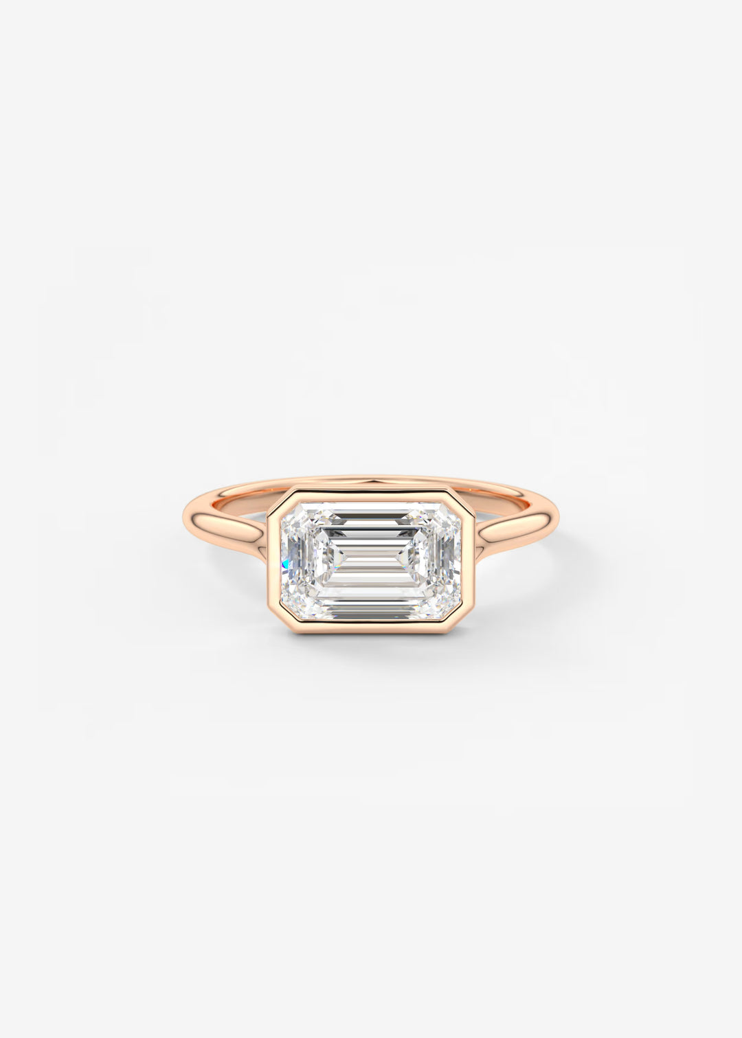 Rose gold ring with a large emerald-cut diamond on a light gray background#material_rose