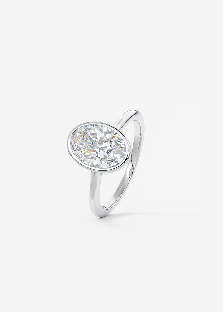 The Blanche Modern Oval Cut Bezel Set Engagement Ring#material_white