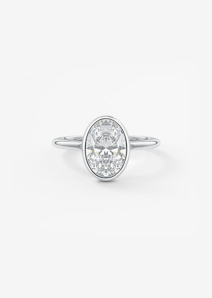 The Blanche Modern Oval Cut Bezel Set Engagement Ring#material_white