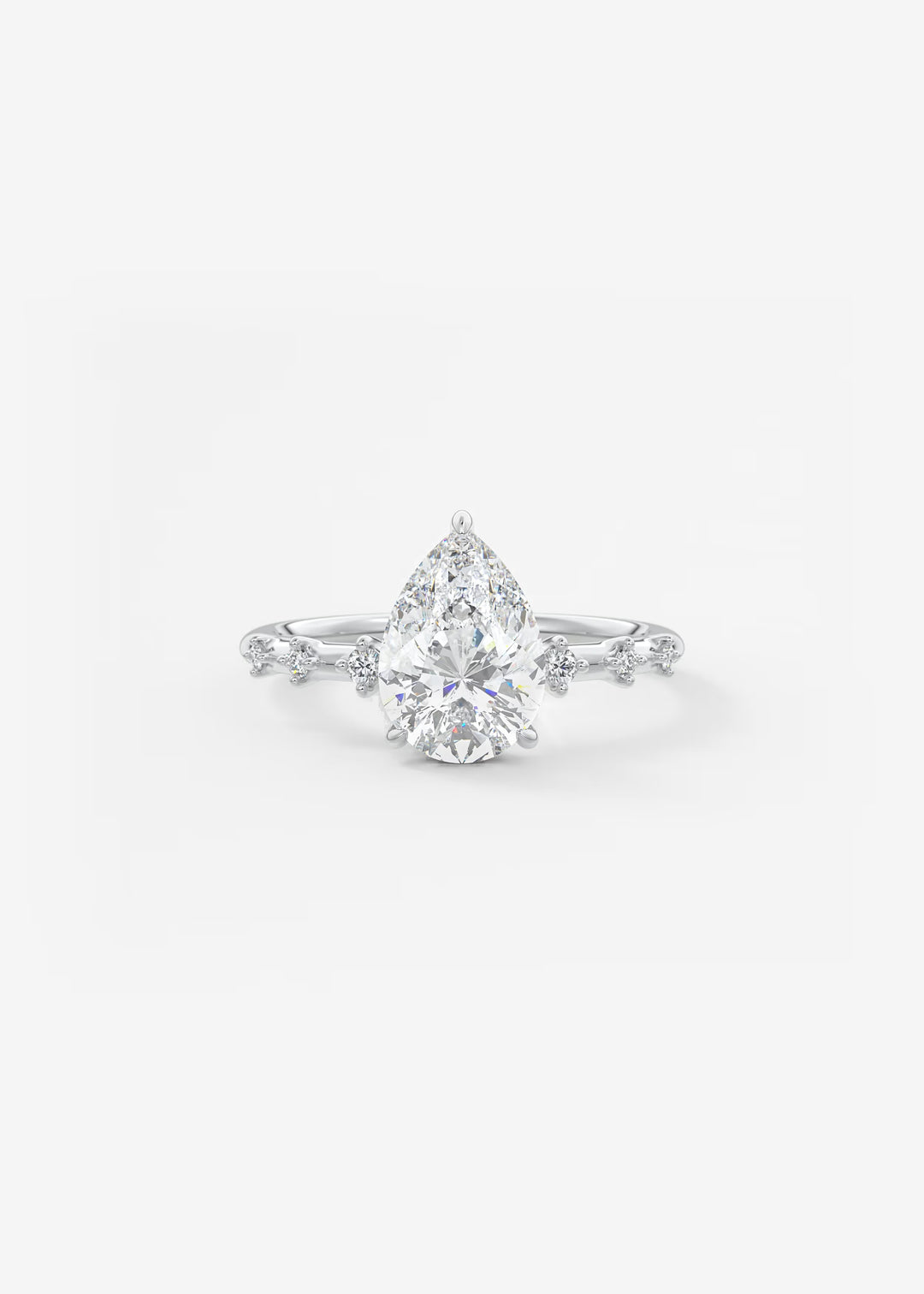 A pear-cut diamond engagement ring with a silver-toned diamond-accented band, centered on a clean white background.#material_white