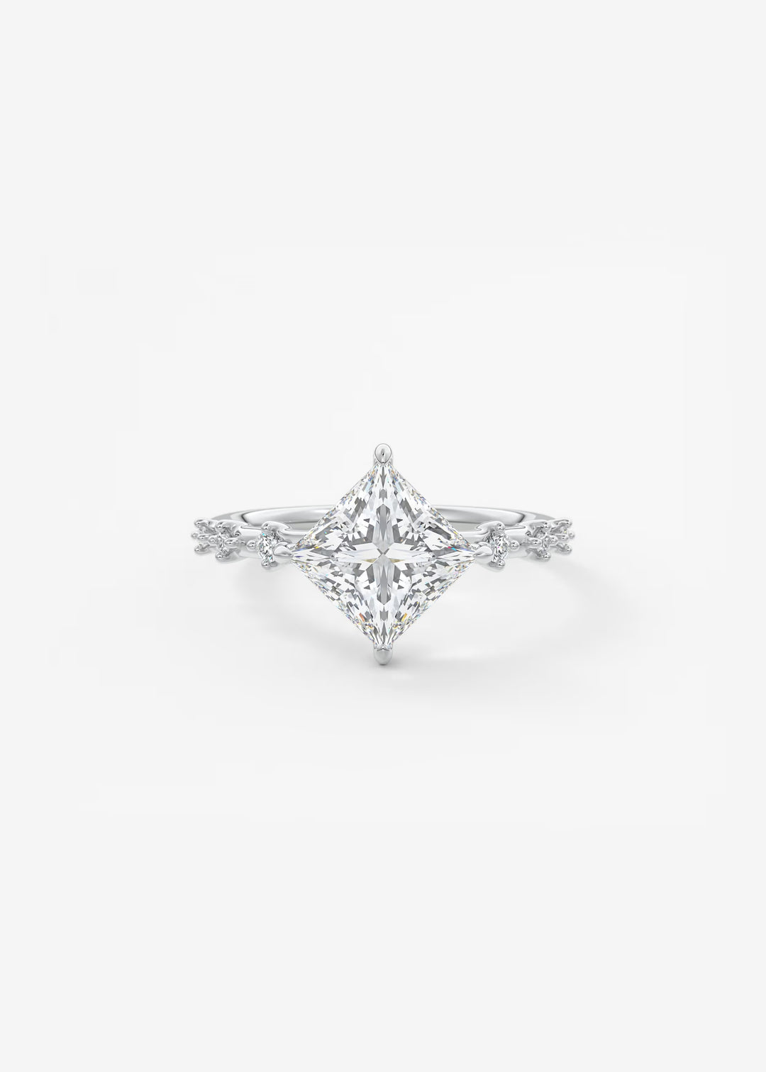 A silver-toned diamond engagement ring featuring a large princess-cut center stone and a delicate diamond-accented band, set against a clean white background.#material_white