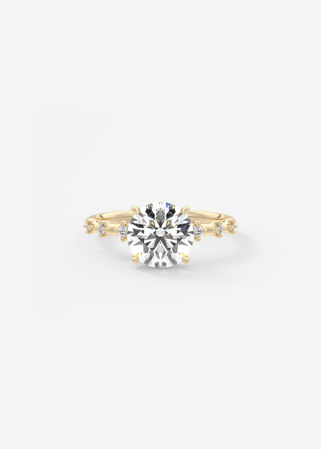 A yellow gold solitaire engagement ring with a round brilliant-cut center stone and small accent stones along the shoulders, set against a plain white background.#material_gold