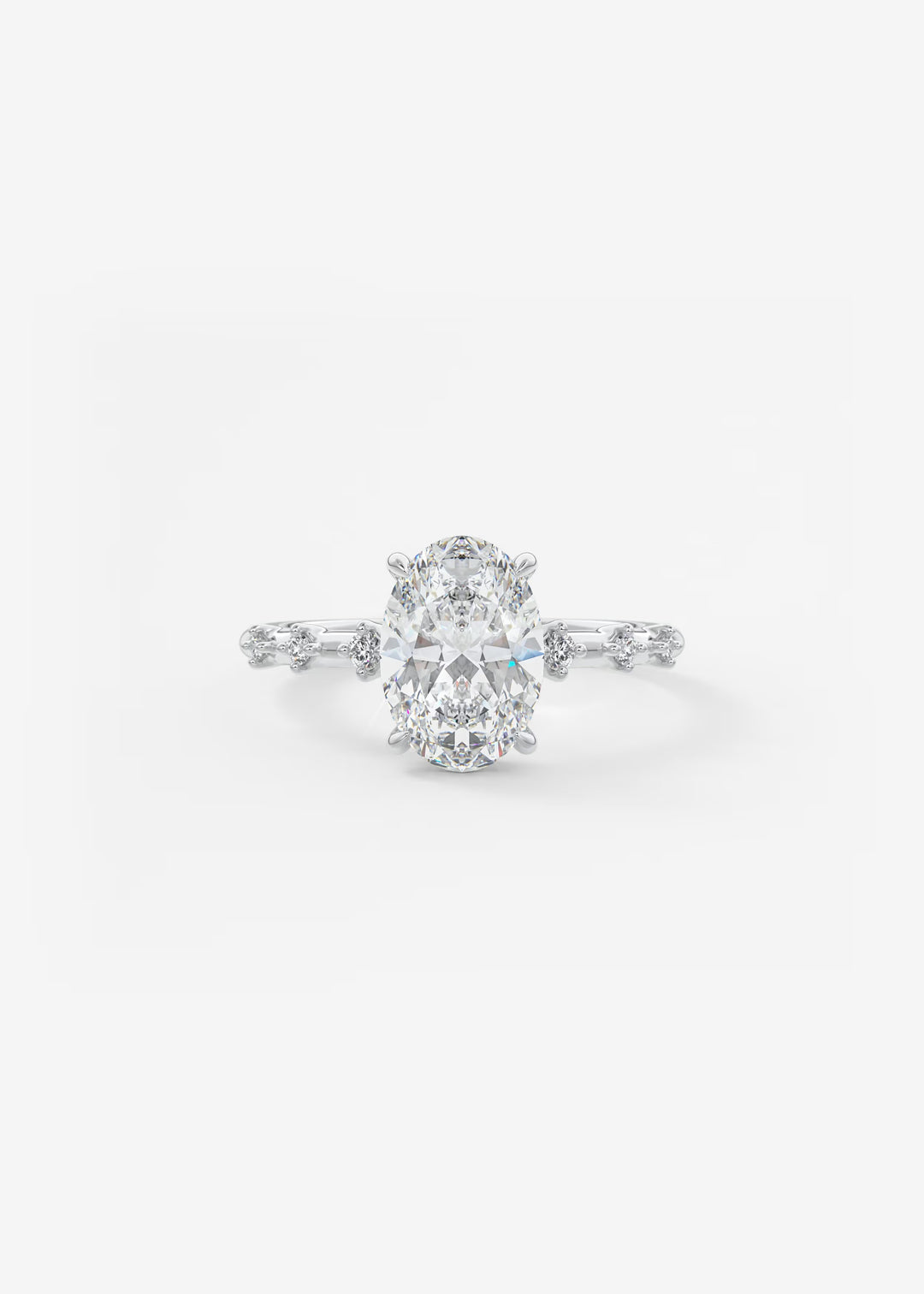A silver-toned diamond engagement ring featuring a large oval-cut center stone with smaller diamonds along the shoulders, set against a plain white background.#material_white
