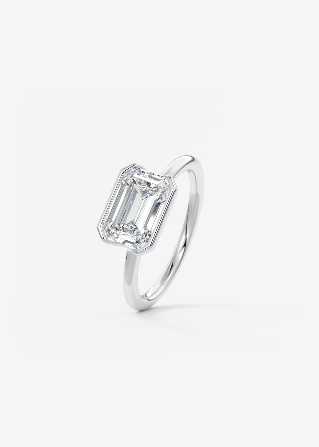 The Colette Horizon Signature East West Emerald Cut Half Bezel Engagement Ring#material_white