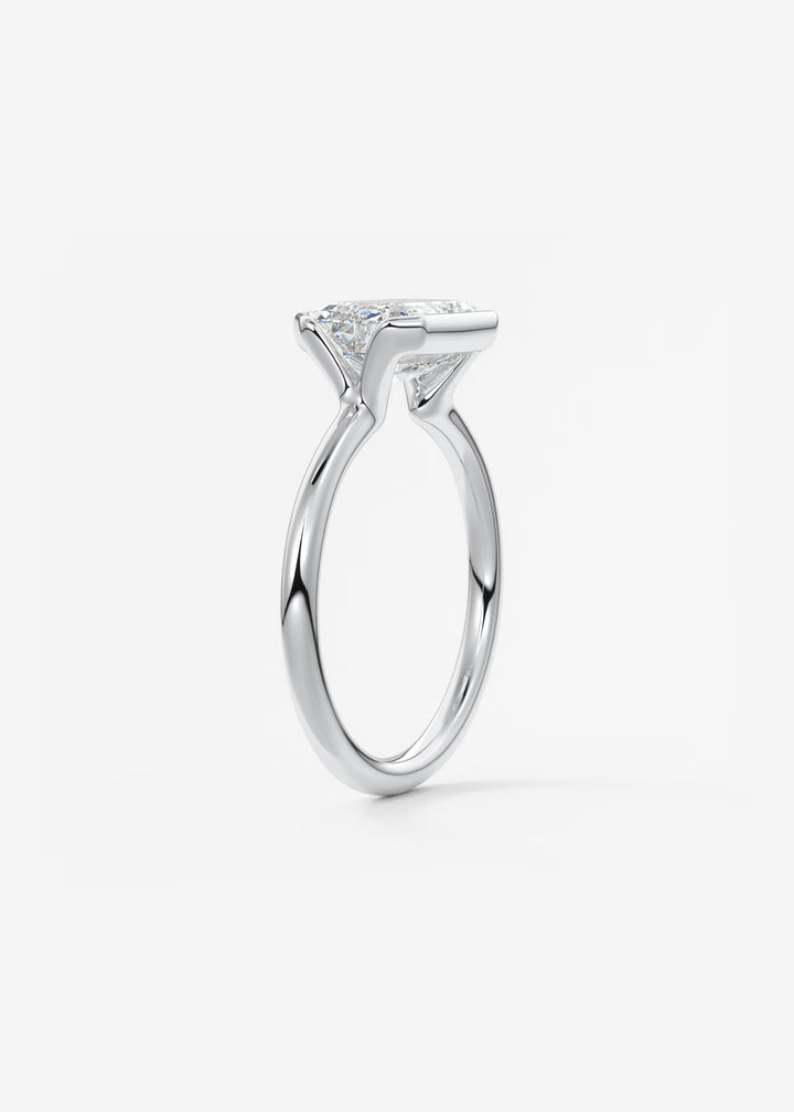 The Colette Horizon Signature East West Emerald Cut Half Bezel Engagement Ring#material_white