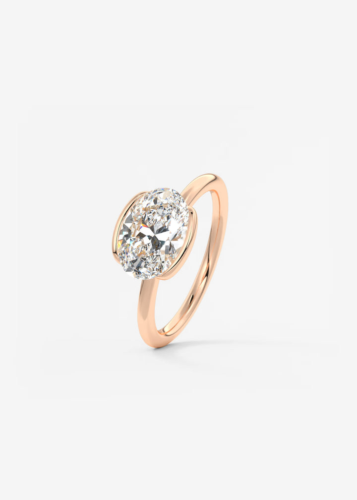 The Colette Horizon Signature East West Oval Cut Half Bezel Engagement Ring#material_rose