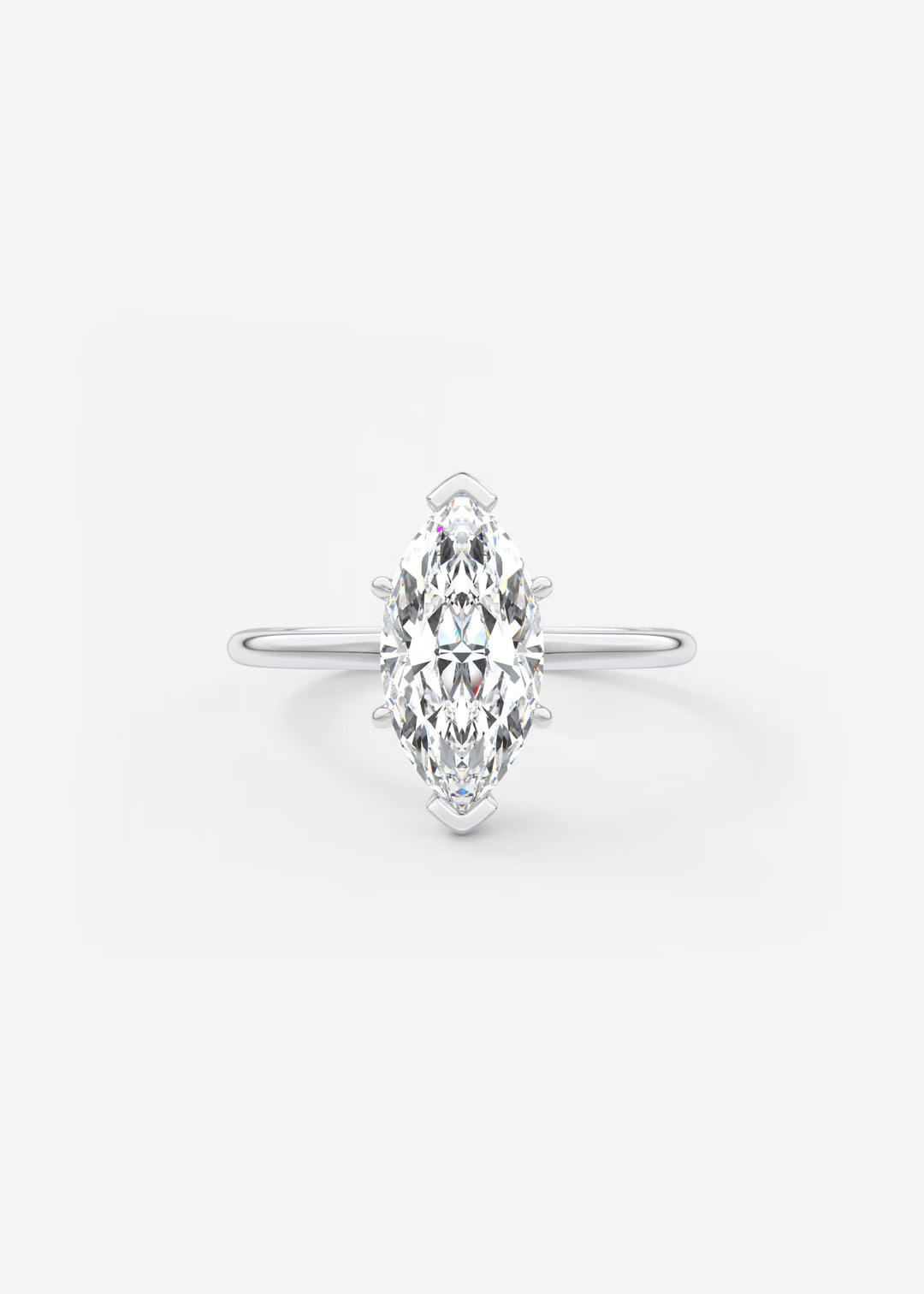 A silver-tone ring featuring a marquise-cut clear gemstone in a prong setting, centered on a plain light gray background.#material_white