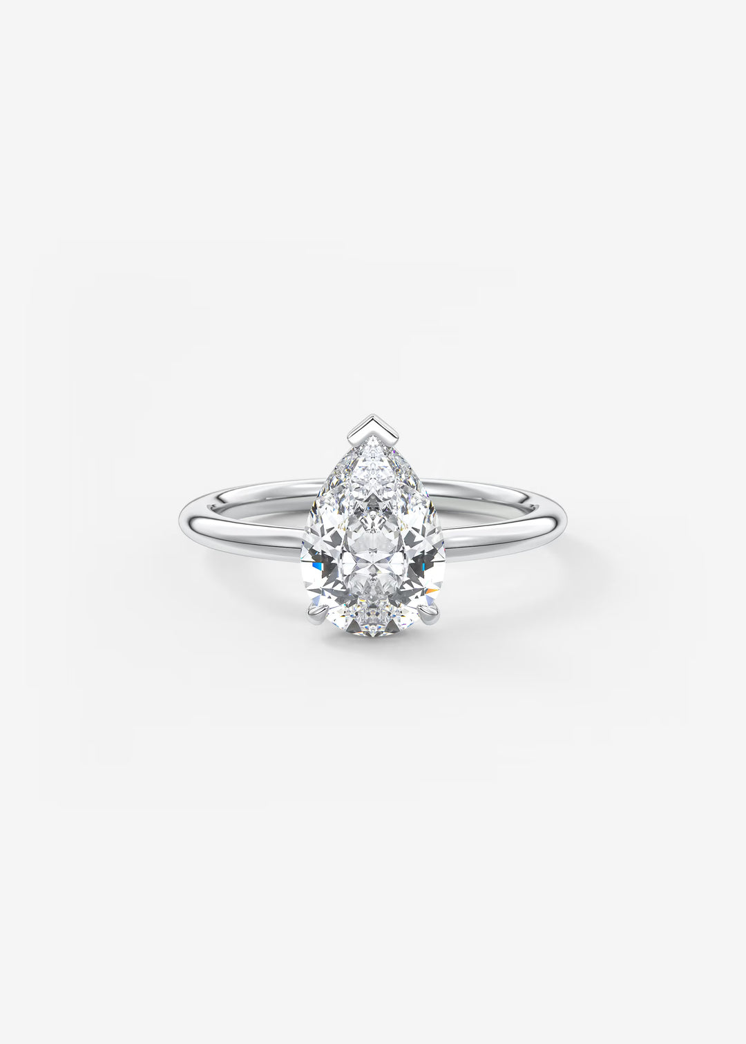 A pear-cut diamond engagement ring in a silver-toned solitaire setting, centered on a clean white background.#material_white