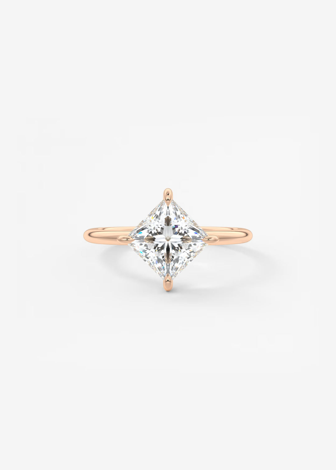 Rose gold ring with a large diamond on a light gray background#material_rose