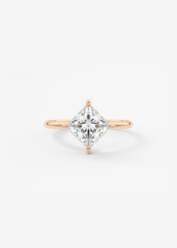 Rose gold ring with a large diamond on a light gray background#material_rose