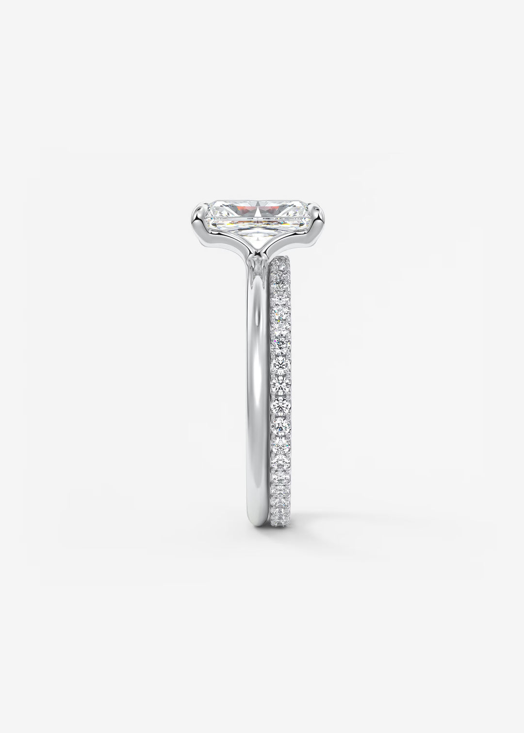 Diamond ring with a white gold band on a light gray background #material_white