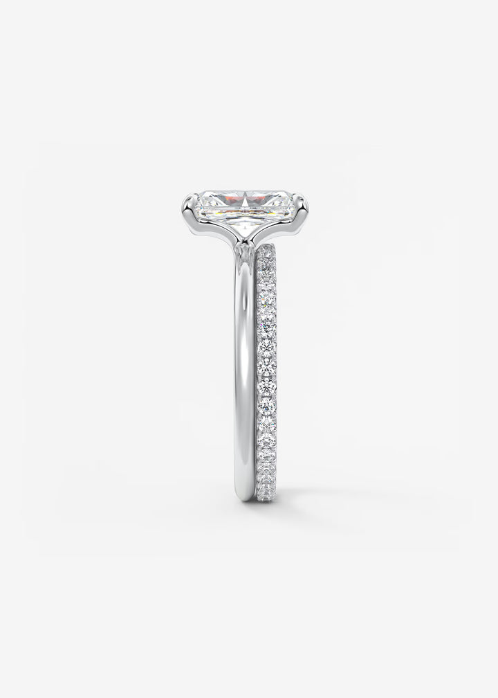 Diamond ring with a white gold band on a light gray background #material_white