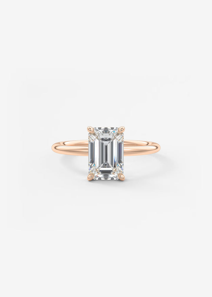 Rose Gold ring with a diamond on a white background#material_rose
