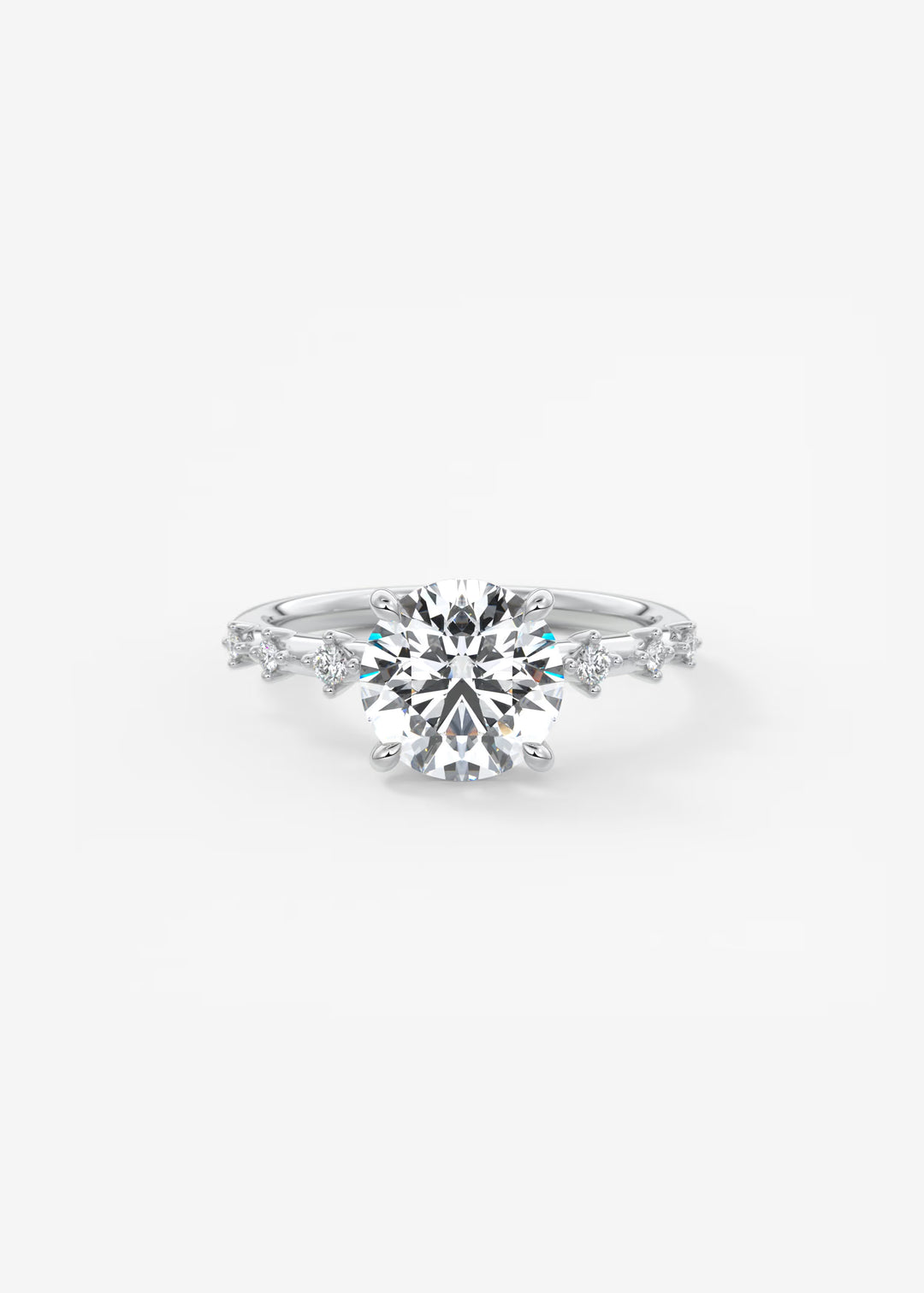 A silver-toned diamond engagement ring featuring a large round-cut center stone and smaller diamonds along the band, set against a clean white background.#material_white