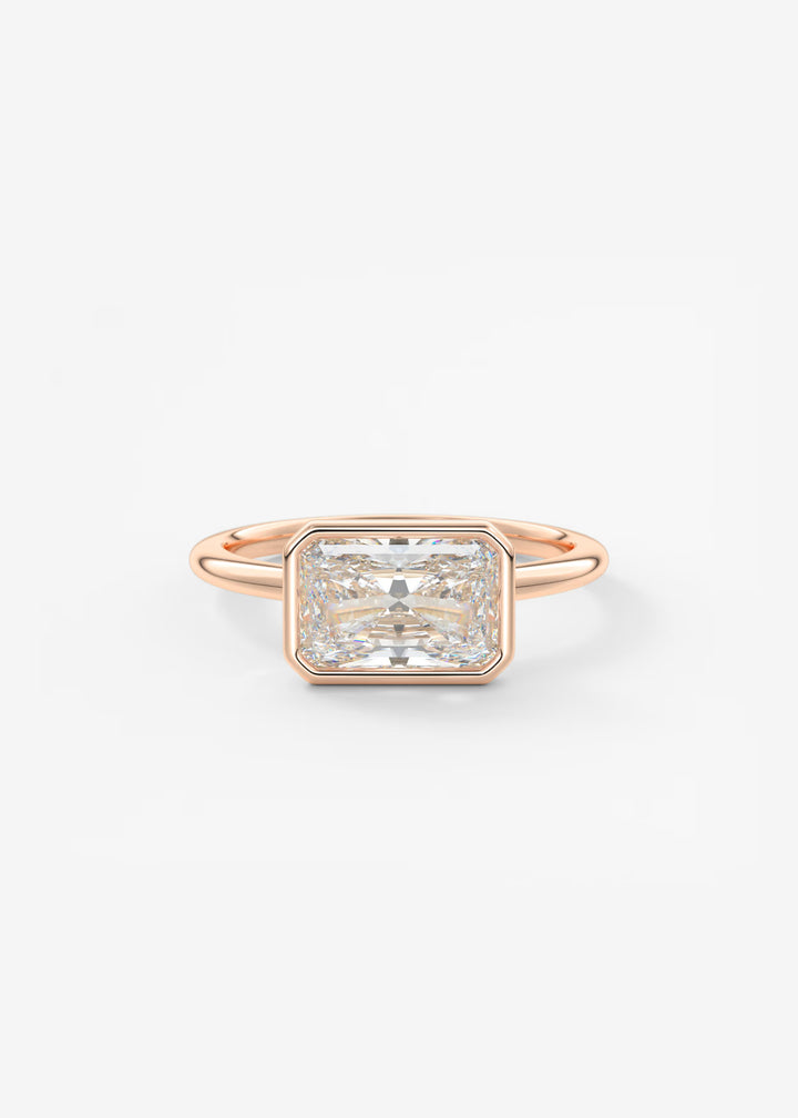 Rose gold ring with a large diamond on a light gray background#material_rose
