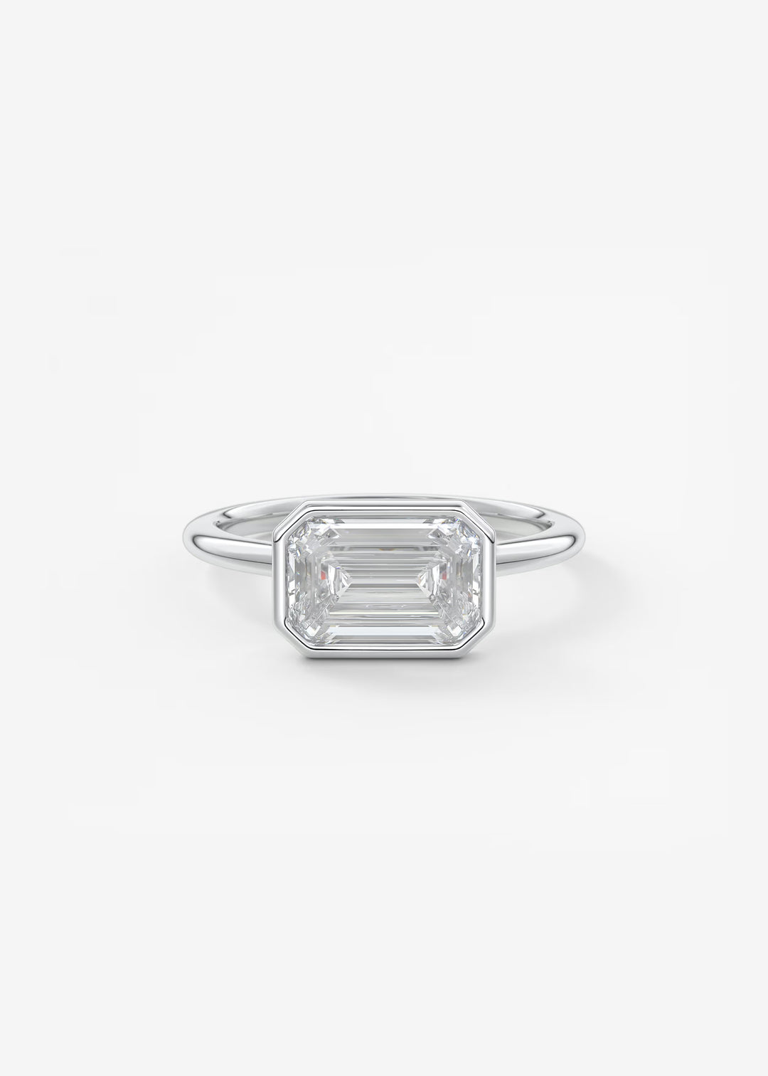 Silver ring with a rectangular gemstone on a white background#material_white