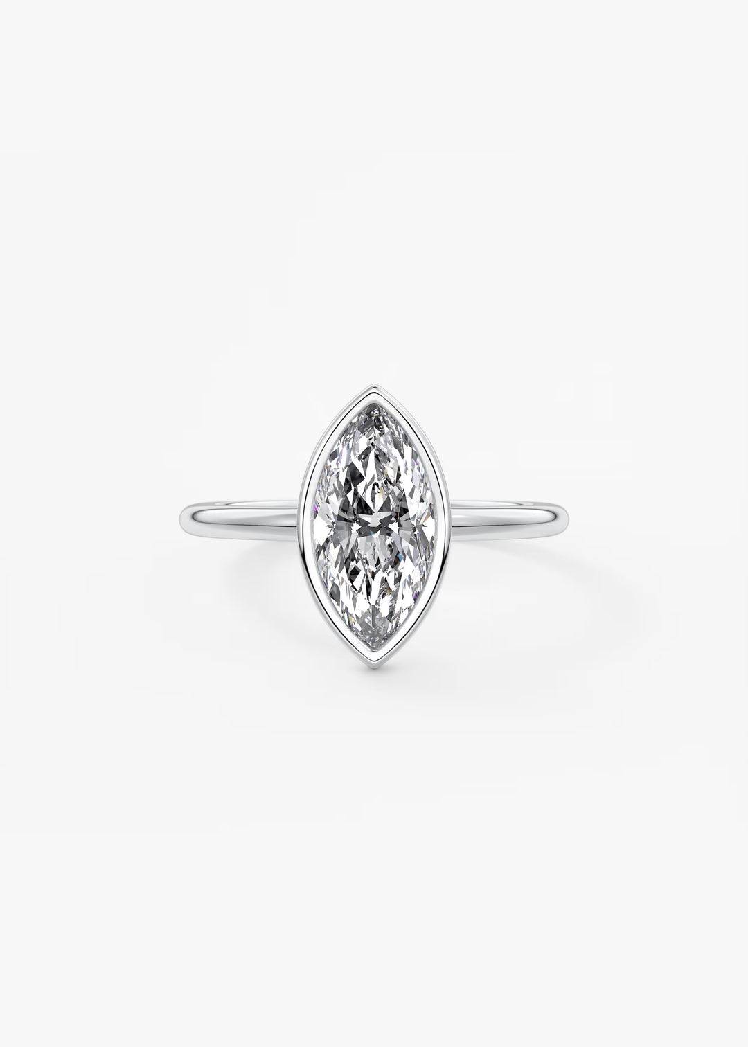 A silver-tone ring featuring a marquise-cut clear gemstone in a prong setting, centered on a plain light gray background.#material_white