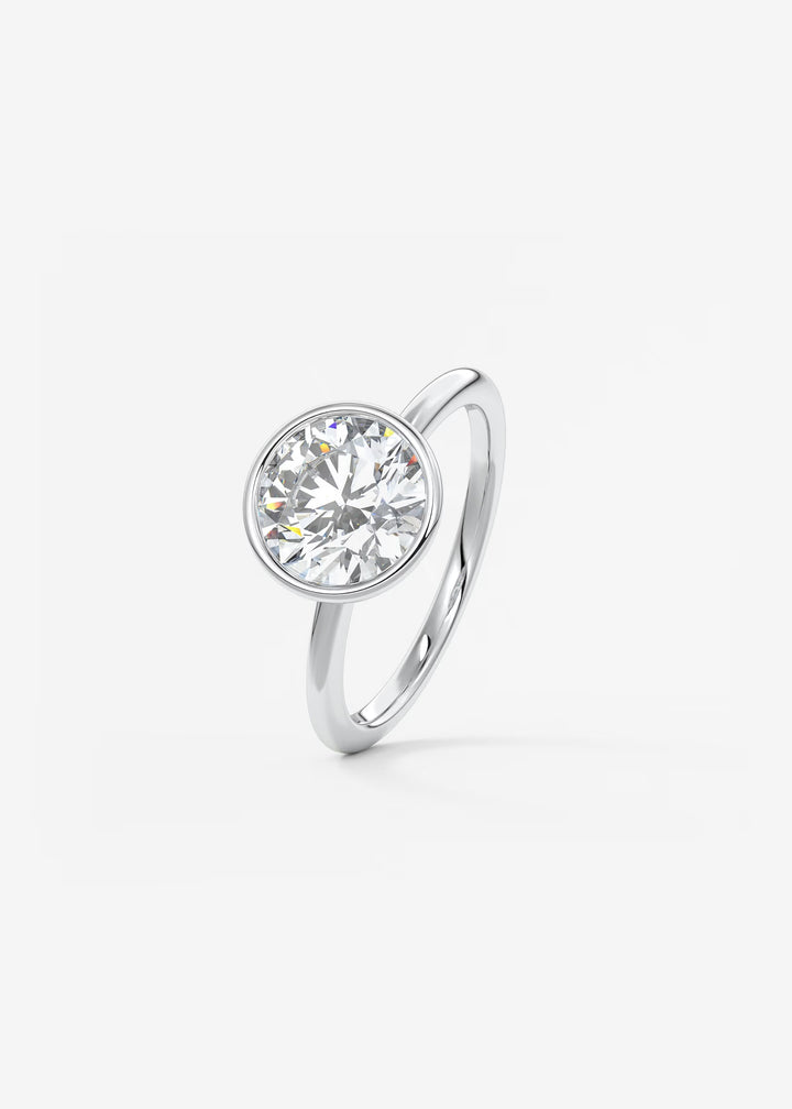 The Laurier Low Profile Bezel Set Solitaire Engagement Ring#material_white