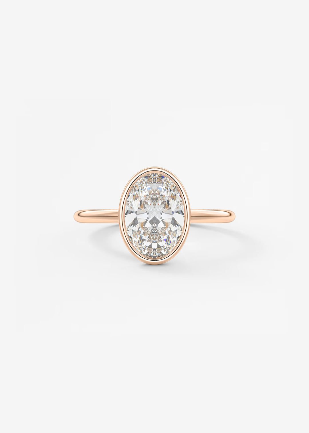 A rose gold ring featuring a large oval-cut clear gemstone in a prong setting, shown against a clean white background.#material_rose