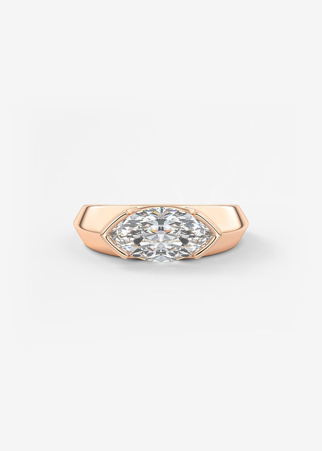 A rose gold ring featuring a marquise-cut diamond set in a shield-like bezel, shown on a clean white background.#material_rose