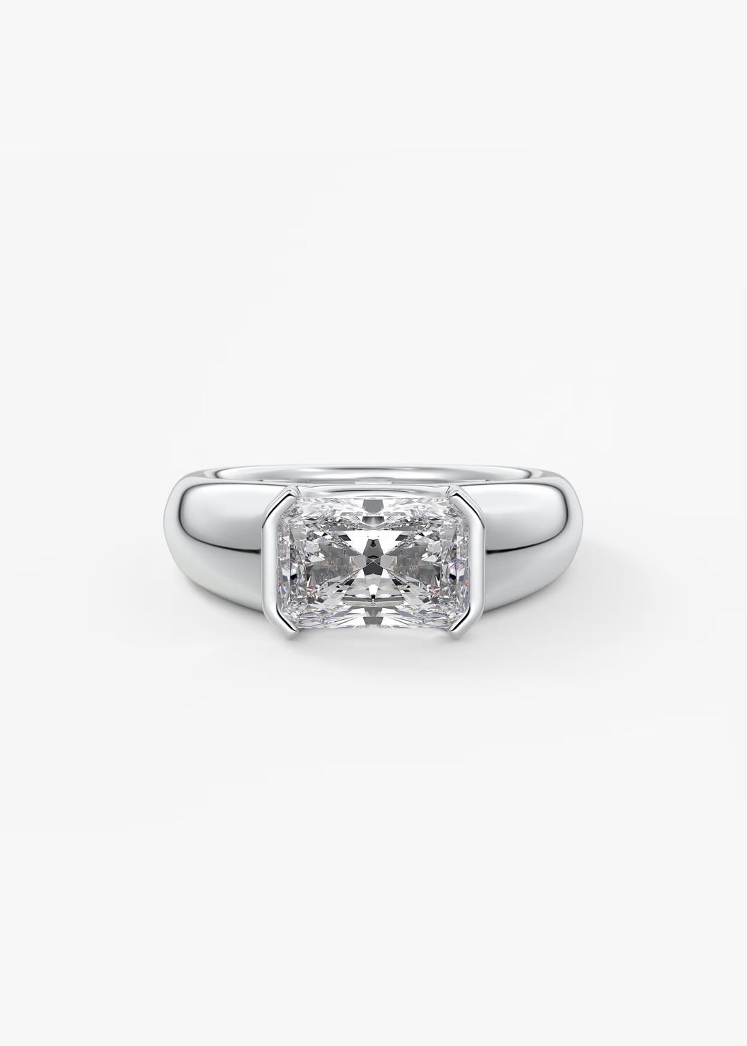 A silver-toned ring featuring a large rectangular clear gemstone in a prong setting, shown against a plain light gray background.#material_white