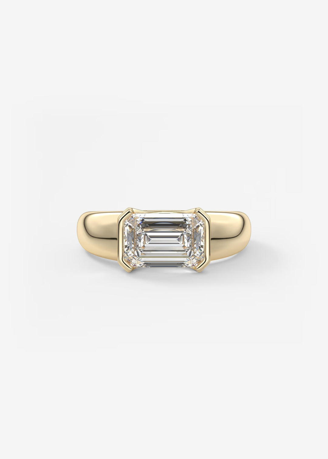 Gold ring with emerald-cut diamond on a white background#material_gold
