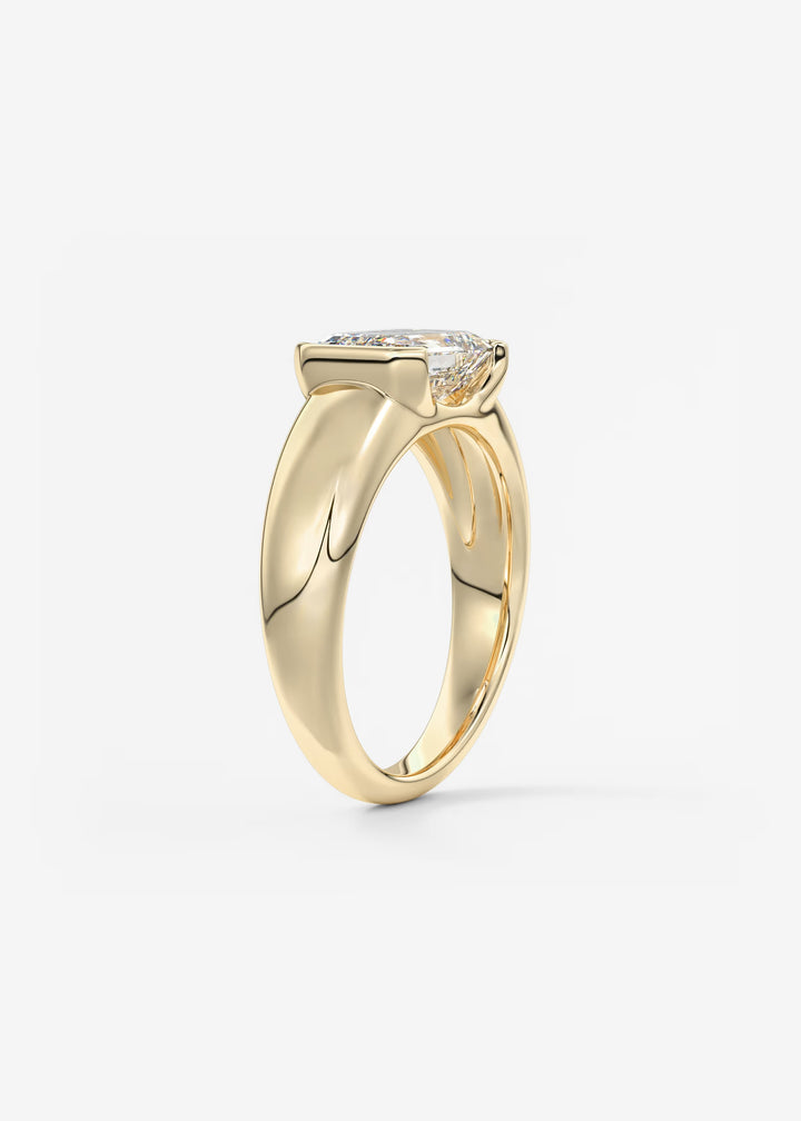 The Lune Horizon Chunky Emerald Cut Half Bezel Engagement Ring with Peekaboo Gallery#material_gold