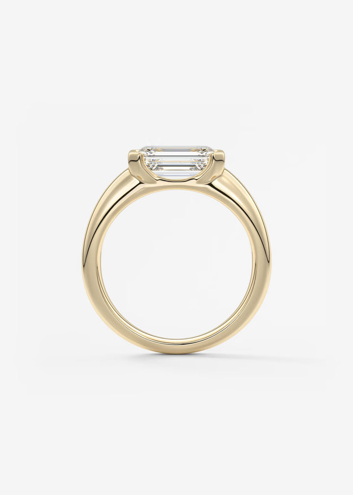 The Lune Horizon Chunky Emerald Cut Half Bezel Engagement Ring with Peekaboo Gallery#material_gold