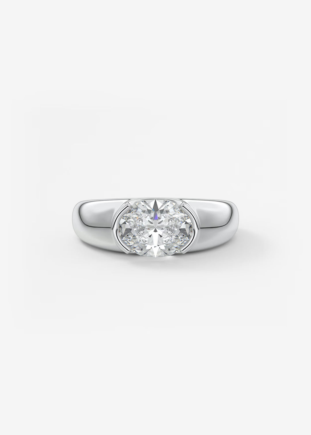 A classic solitaire engagement ring featuring a round brilliant-cut diamond set in a polished silver-colored band, presented on a clean white background.#material_white