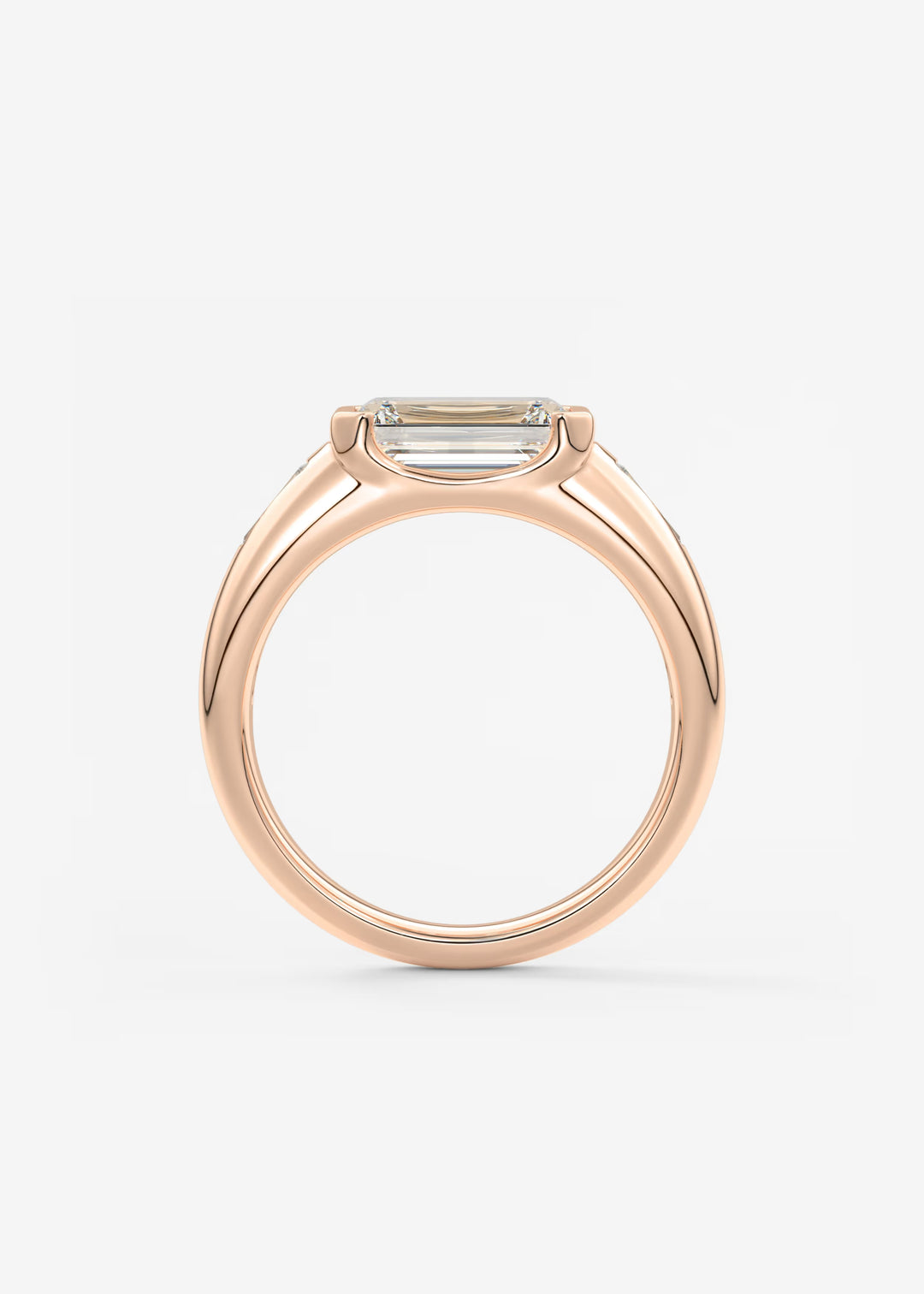 The Lune Trio Emerald Cut Half Bezel Three Stone Engagement Ring with Peekaboo Gallery and Tapered Baguettes#material_rose