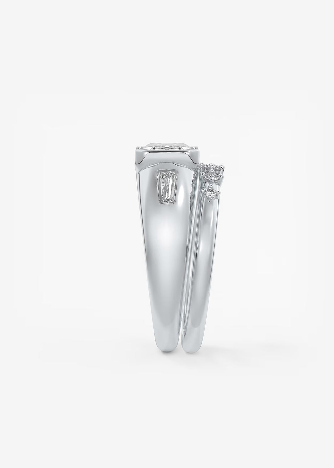 The Lune Trio Emerald Cut Half Bezel Three Stone Engagement Ring with Peekaboo Gallery and Tapered Baguettes#material_white