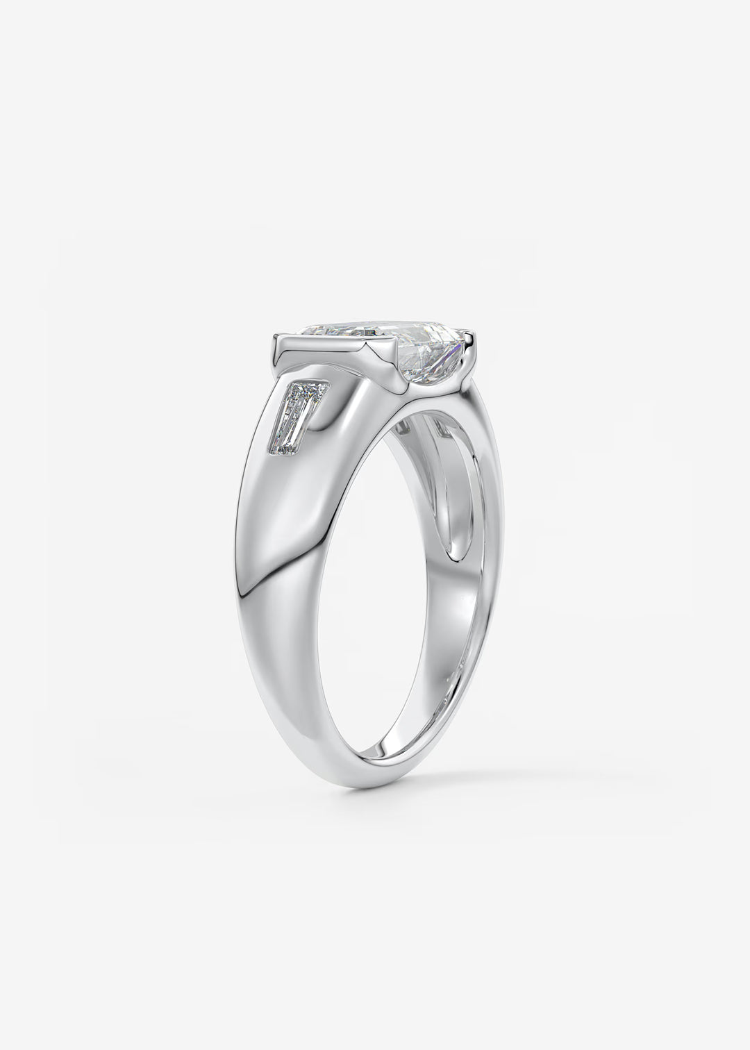 The Lune Trio Emerald Cut Half Bezel Three Stone Engagement Ring with Peekaboo Gallery and Tapered Baguettes#material_white