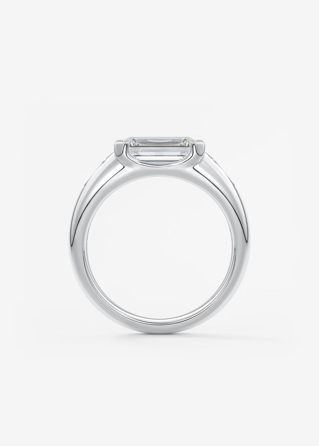 The Lune Trio Emerald Cut Half Bezel Three Stone Engagement Ring with Peekaboo Gallery and Tapered Baguettes#material_white