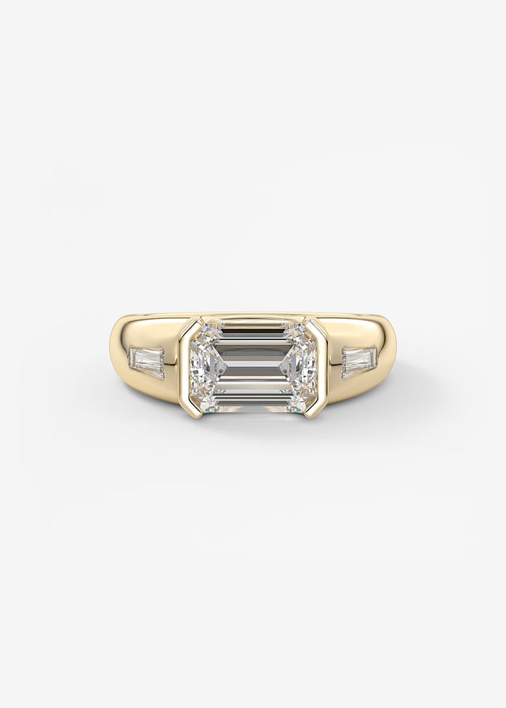 Gold ring with emerald-cut diamond on a white background#material_gold