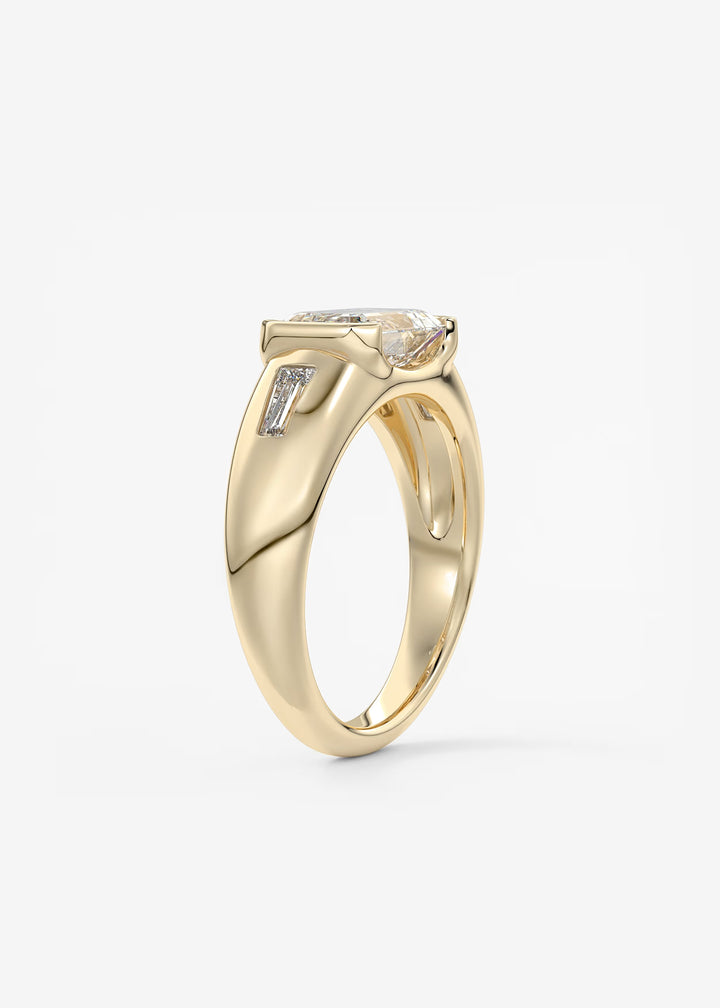 The Lune Trio Emerald Cut Half Bezel Three Stone Engagement Ring with Peekaboo Gallery and Tapered Baguettes#material_gold
