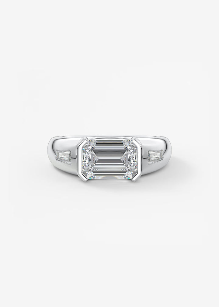 Diamond ring with emerald-cut center stone on a white background#material_white