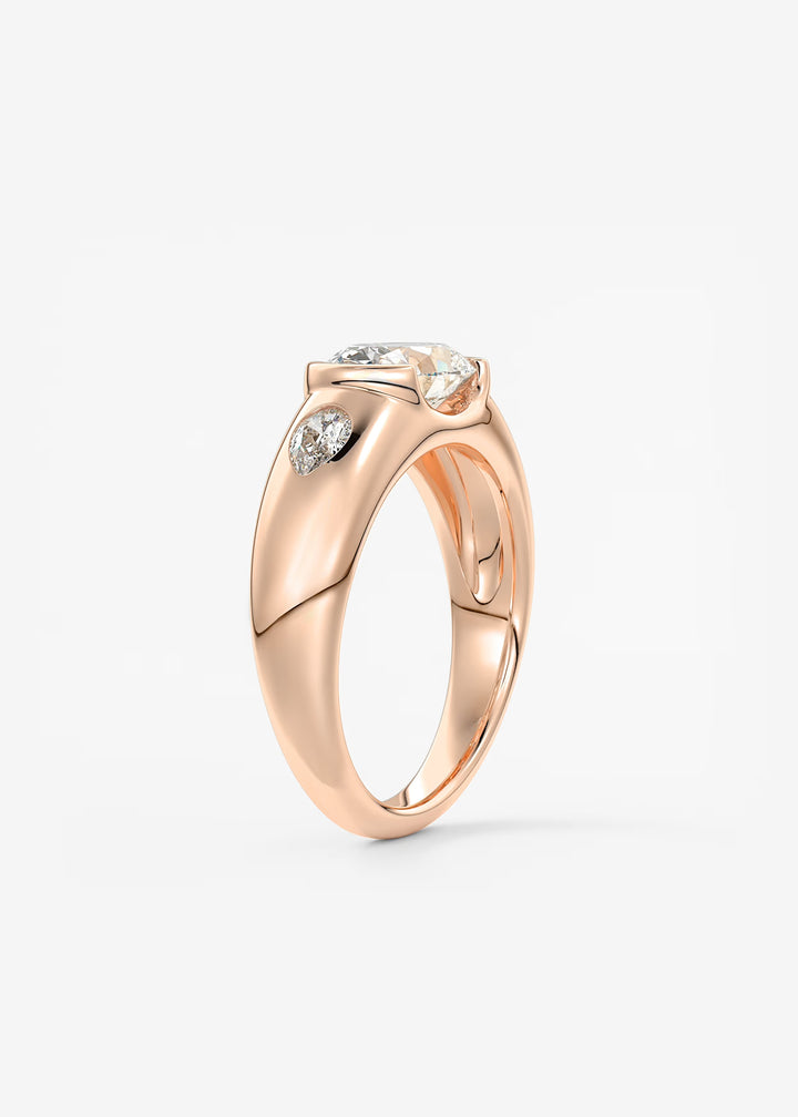 The Lune Trio Oval Cut Half Bezel Three Stone Engagement Ring with Peekaboo Gallery and Tapered Baguettes#material_rose