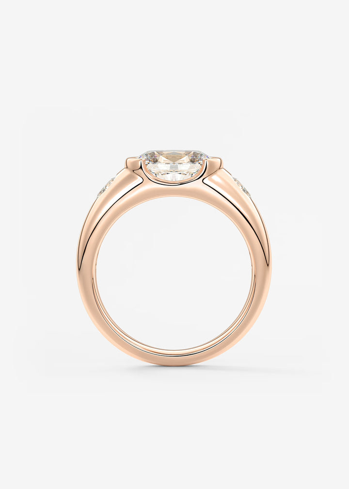 The Lune Trio Oval Cut Half Bezel Three Stone Engagement Ring with Peekaboo Gallery and Tapered Baguettes#material_rose