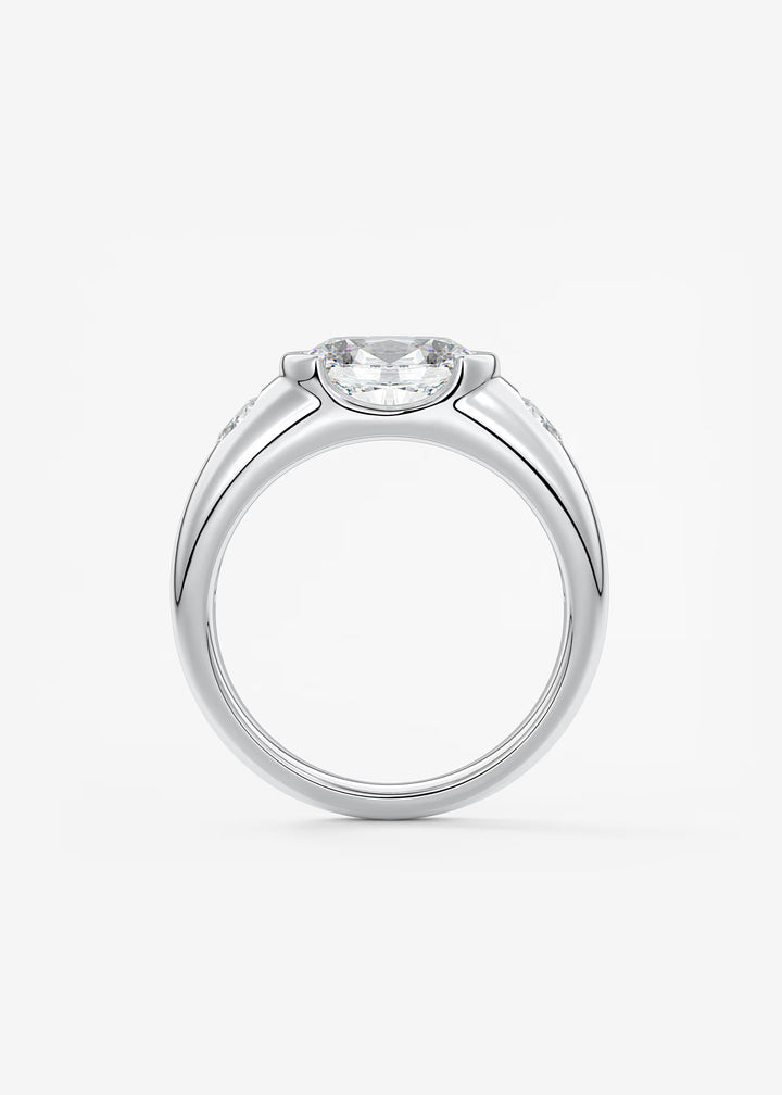 The Lune Trio Oval Cut Half Bezel Three Stone Engagement Ring with Peekaboo Gallery and Tapered Baguettes#material_white