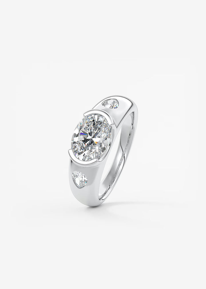 The Lune Trio Oval Cut Half Bezel Three Stone Engagement Ring with Peekaboo Gallery and Tapered Baguettes#material_white